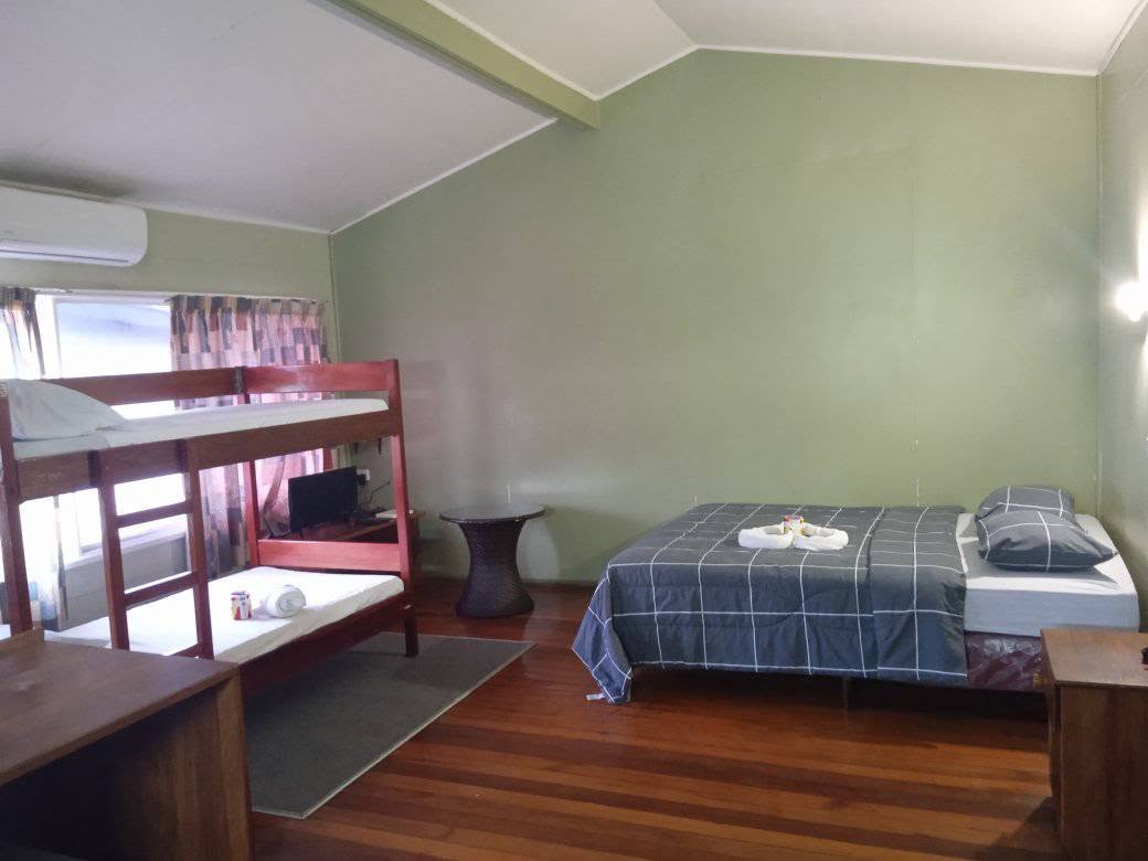 Family room at Mavra Lodge with a double bed and bunk beds